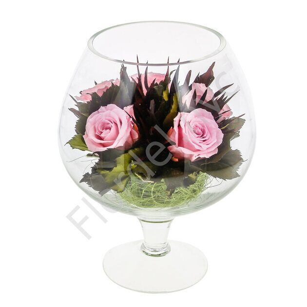 Preserved roses in a glass vase